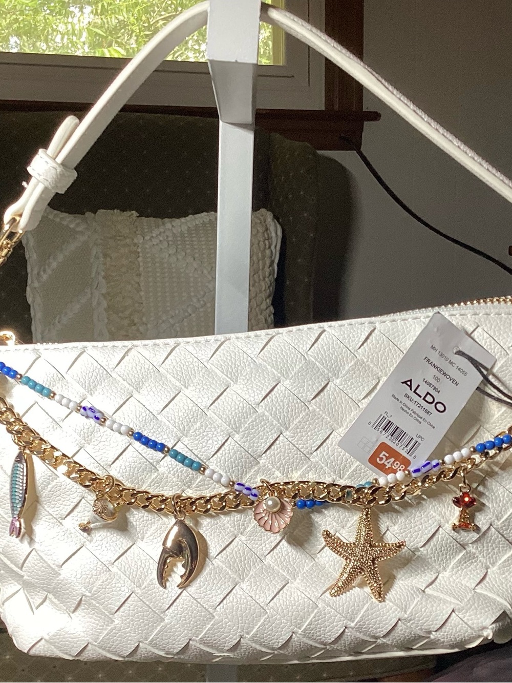 ALDO White Woven Shoulder Bag with Gold Charm Chain and Blue Bead Accents